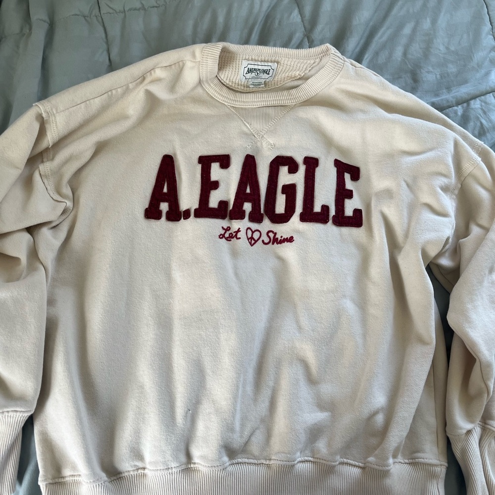 Cream crew neck sweatshirt